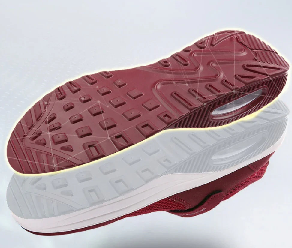 Red and white sneaker sole with detailed tread pattern and air cushion design
