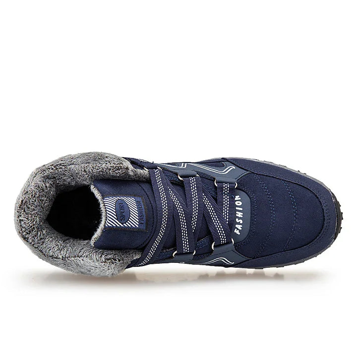 Top view of a navy blue winter sneaker with gray faux fur lining and striped laces marked FASHION