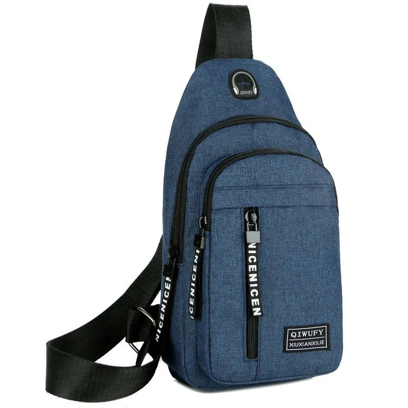 blue sling backpack with black zippers, adjustable black strap, and front patch logo