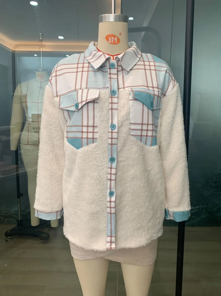 woman's sherpa fleece jacket with blue and brown plaid upper and pockets on mannequin indoors