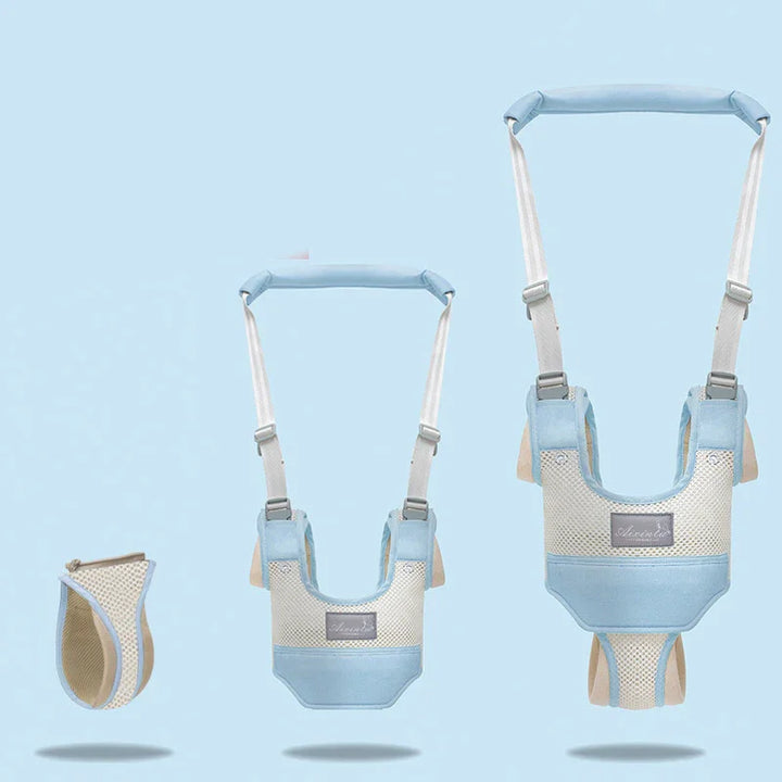 Three blue and beige baby walking harnesses with adjustable straps displayed on a light blue background