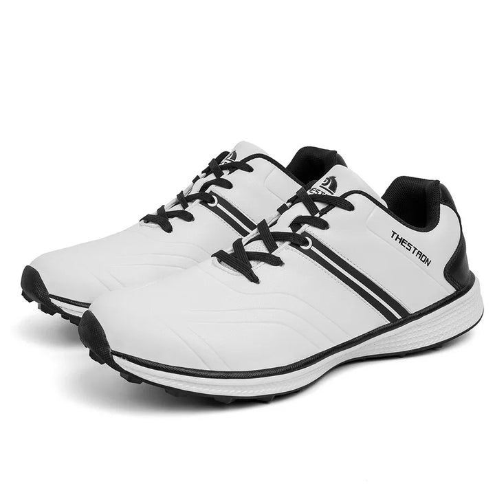 White and black Thestron casual sneakers with lace-up design and textured soles