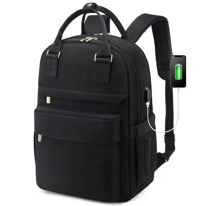 black backpack with top handles and padded shoulder straps featuring USB charging port with connected smartphone