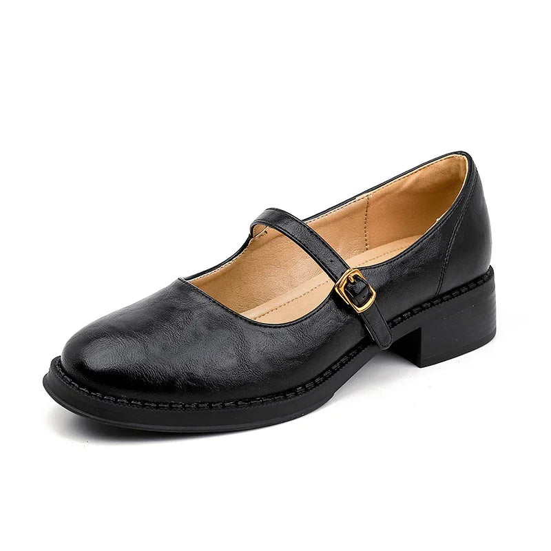 Black Mary Jane leather shoe with low block heel and gold buckle strap