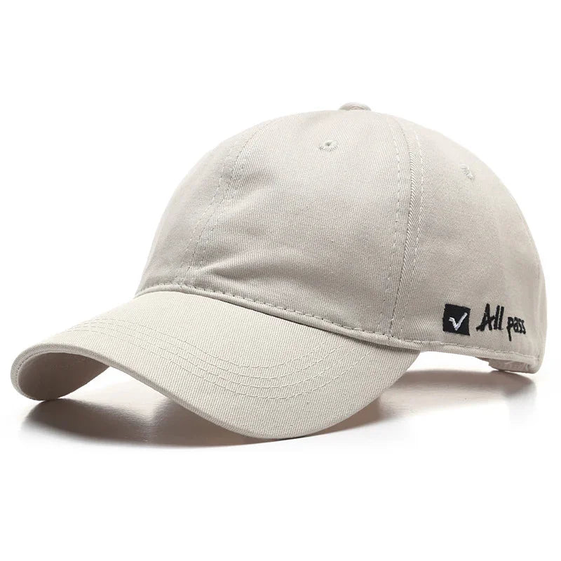 Beige cotton baseball cap with curved brim and black embroidered All pass logo on side