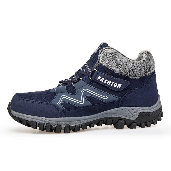 Navy blue winter hiking boot with grey fur lining and rugged black sole labeled Fashion