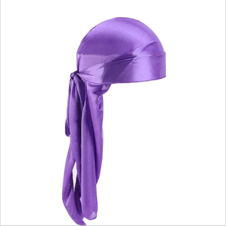 Purple satin durag with long tails tied at the back on white background