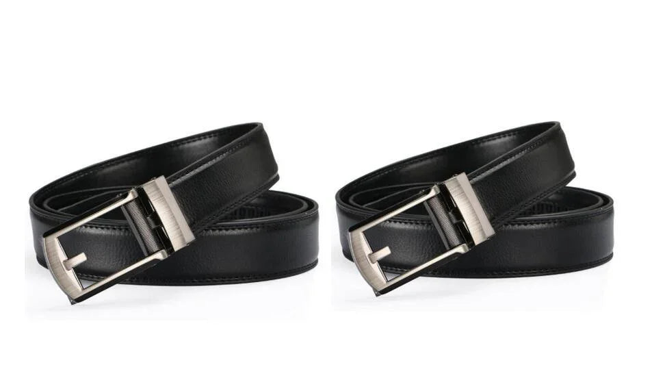 Two black leather belts with silver rectangular buckles isolated on white background