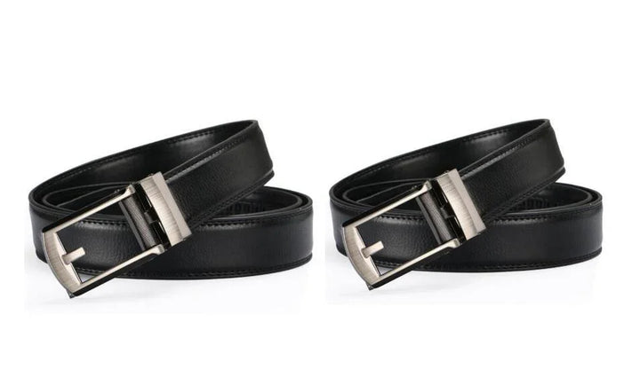 Two black leather belts with silver rectangular buckles isolated on white background