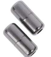 Two black metal magnetic clasps for jewelry on white background