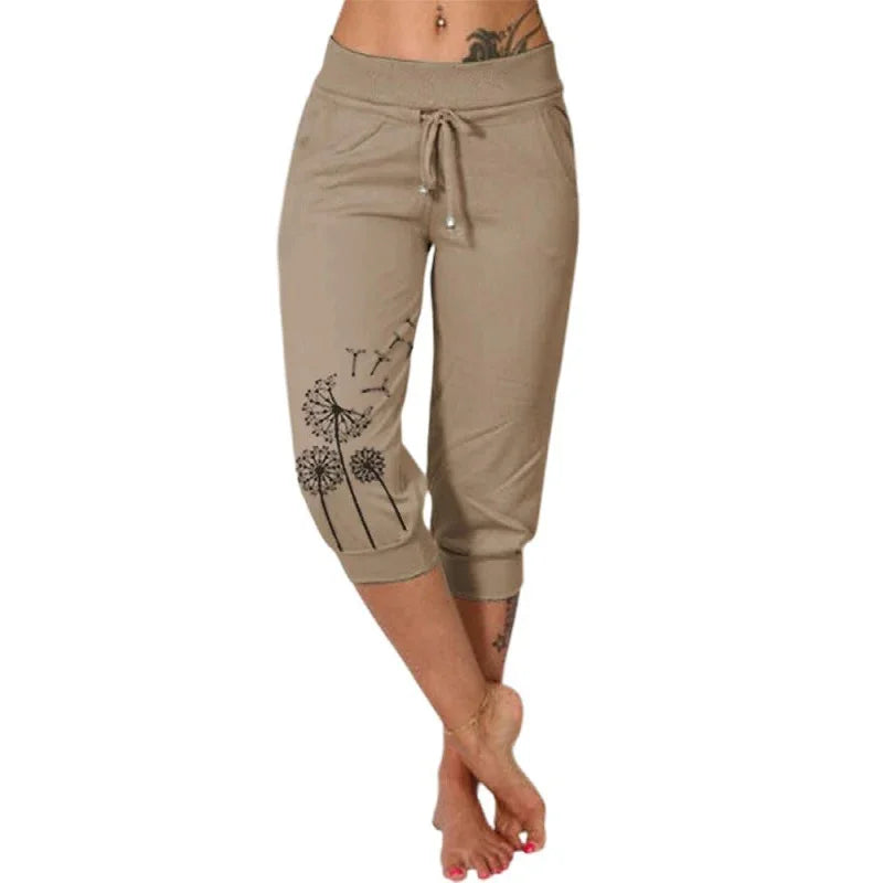 Women’s beige capri pants with black dandelion print and adjustable drawstring waistband