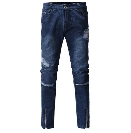 Dark blue distressed skinny jeans with ripped details and ankle zippers
