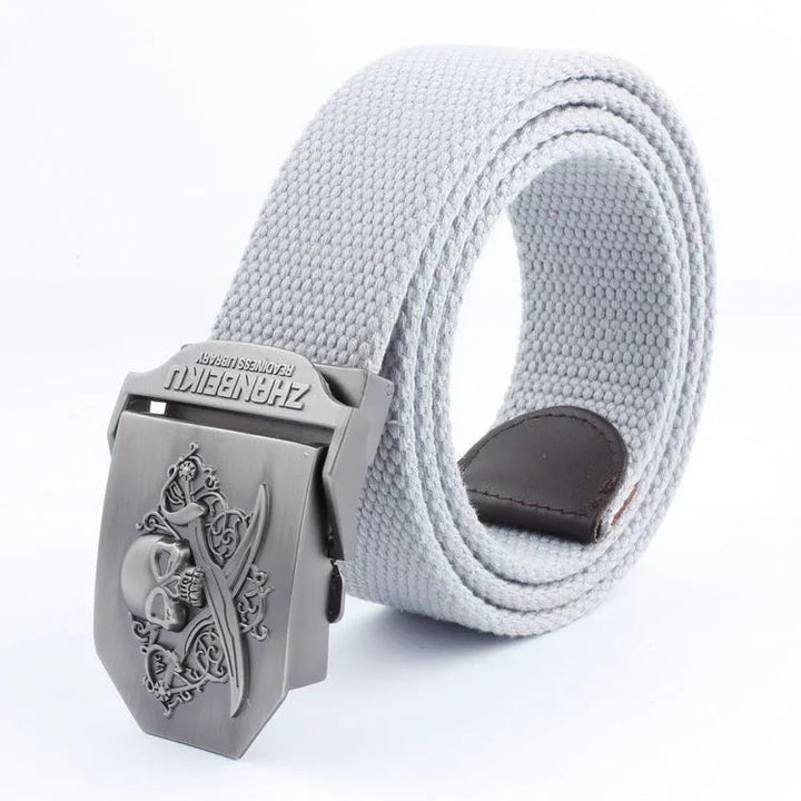 white canvas belt with metal buckle featuring skull and crossed swords design