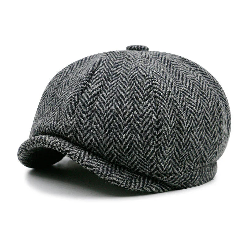 Gray herringbone tweed newsboy cap with rounded crown and small button on top