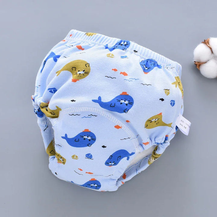 Light blue baby training pants with cartoon seal, whale, and fish pattern, cotton fabric