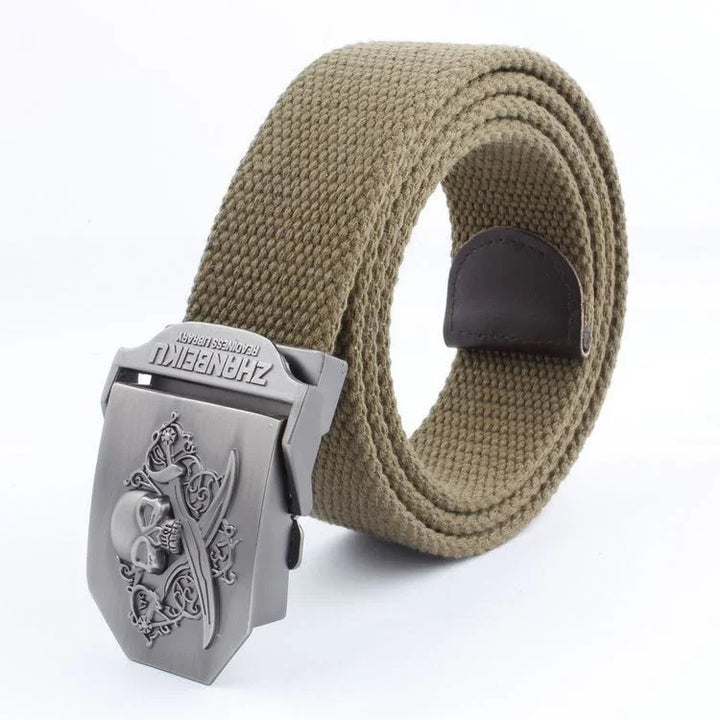 Khaki canvas belt with metal buckle featuring skull and crossbones design, leather loop detail