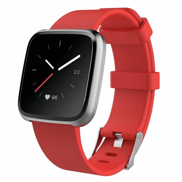 Smartwatch with black square face, red silicone strap, heart rate and time display
