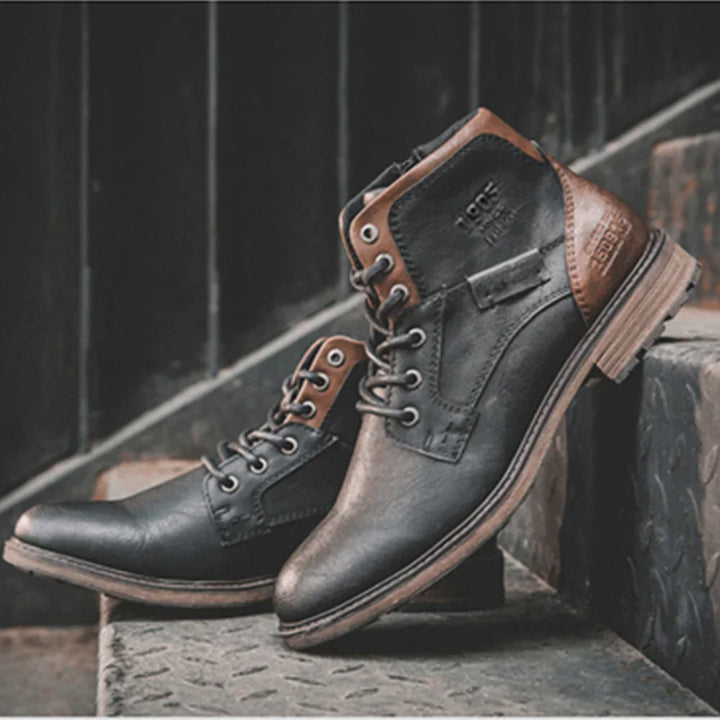 stylish black and brown leather boots with laces displayed on metal stairs