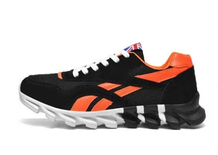 Black and orange athletic sneaker with white laces and rugged sole against white background