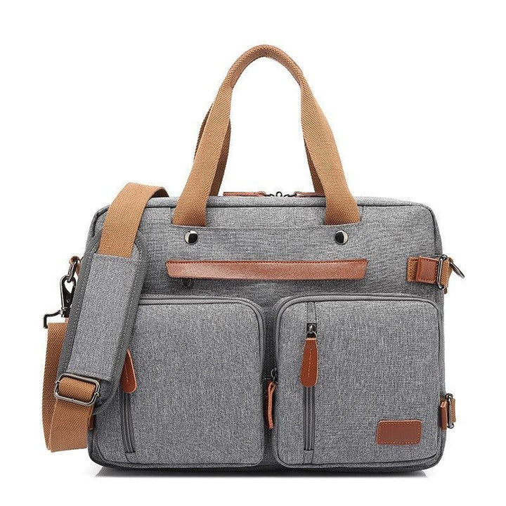 Gray laptop bag with dual front pockets, brown handles, and adjustable shoulder strap
