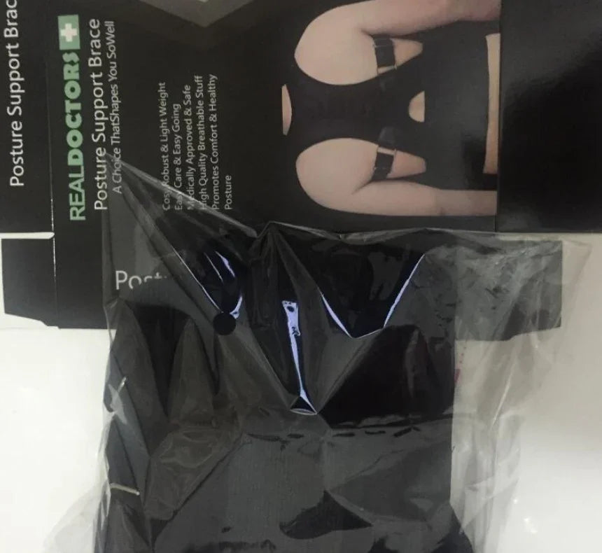 Posture support brace in packaging with product box showing back view and REALDOCTORS branding