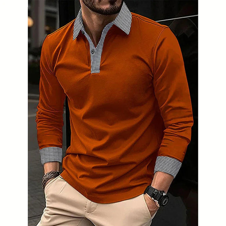 Man wearing orange long sleeve polo shirt with checkered collar and cuffs, paired with beige pants