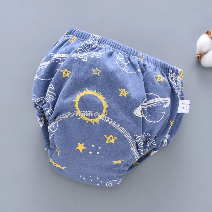 Blue baby diaper cover with yellow stars and white planet and sun space-themed pattern