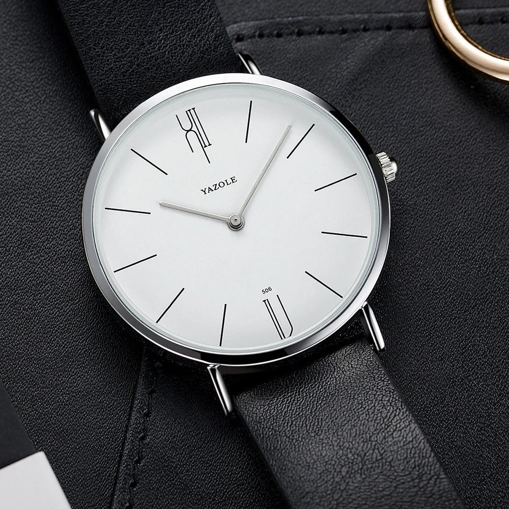 Minimalist Yazole wristwatch with white dial and black leather strap on black textured surface