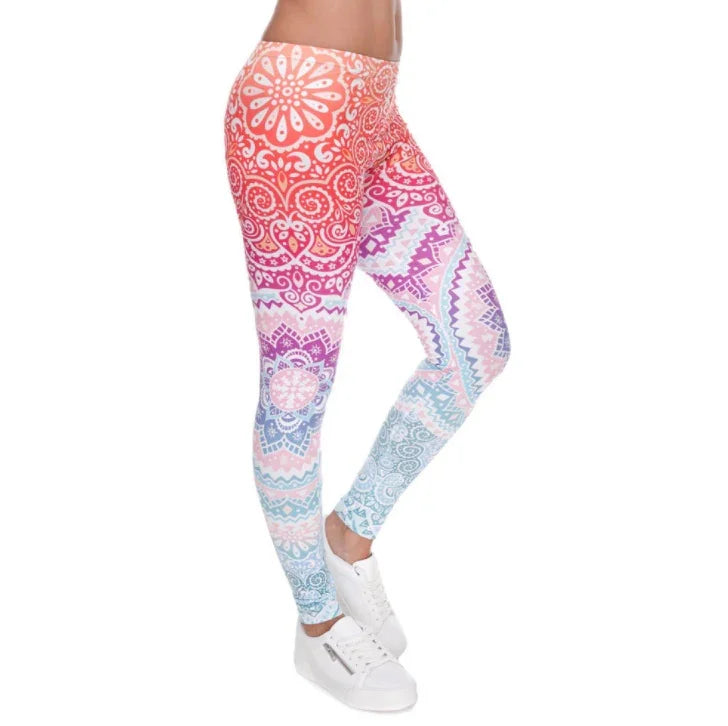 Woman wearing colorful patterned high-waist leggings with white sneakers on white background
