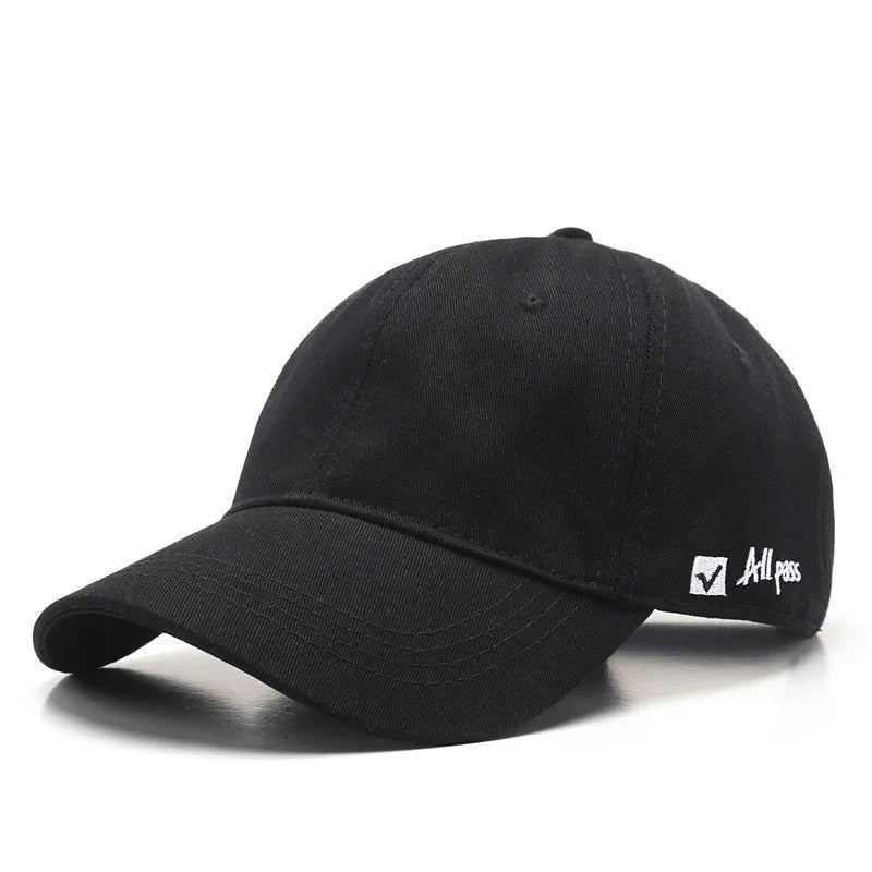 Black baseball cap with curved brim and white embroidered 'All pass' text and checkmark on side