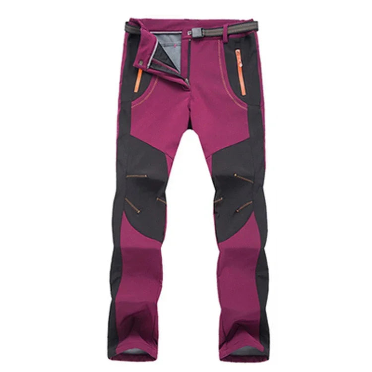 Purple and black outdoor hiking pants with orange zipper pockets and adjustable belt