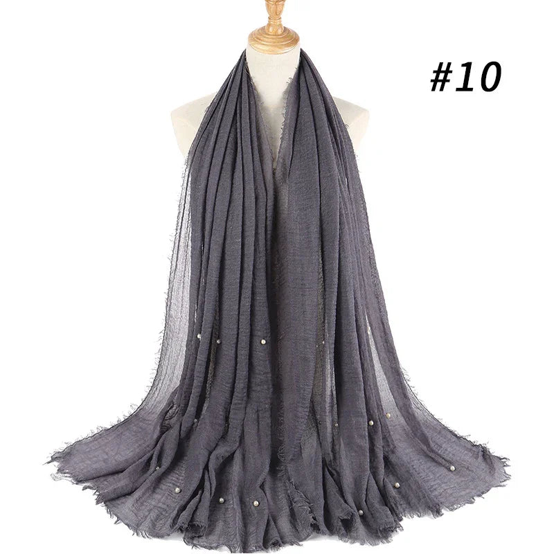 dark gray lightweight scarf with small pearl embellishments displayed on white mannequin