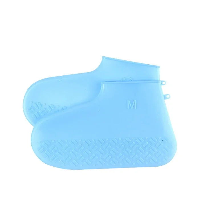 Pair of blue silicone waterproof shoe covers with textured soles, size medium