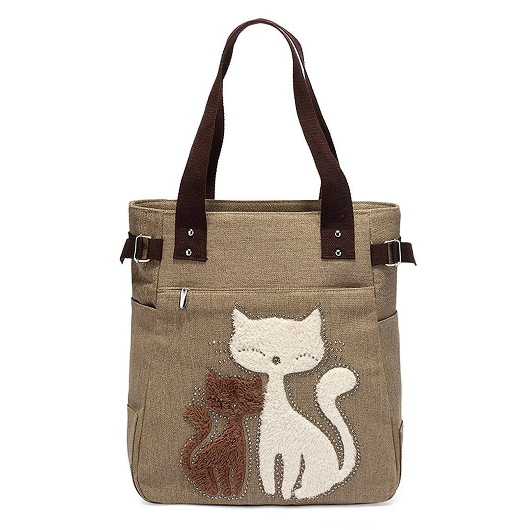 Brown tote bag with dark handles featuring cute textured white and brown cat designs