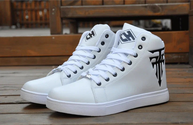 White high-top sneakers with black logo and CH branding on wooden floor background