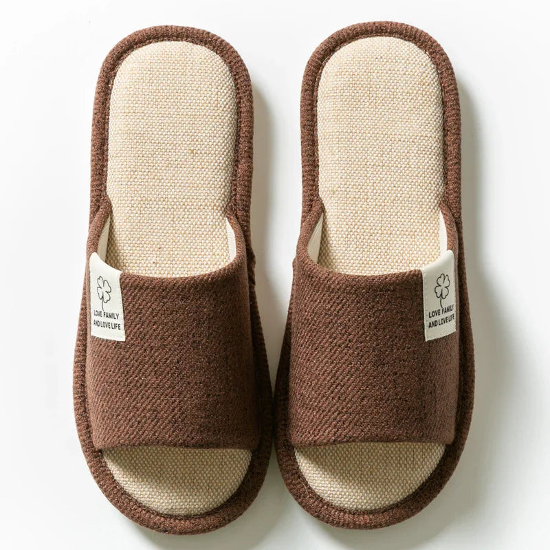 Brown fabric open-toe slippers with beige cushioned insoles and label reading Love Family and Love Life