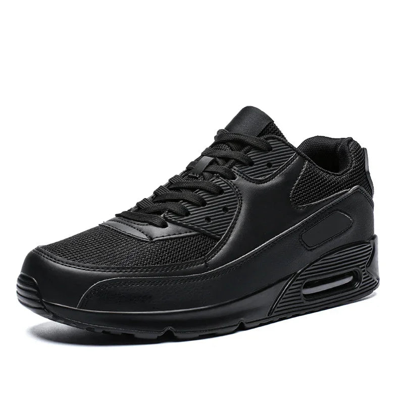 Black athletic sneaker with mesh and leather upper, cushioned sole, and air cushioning unit