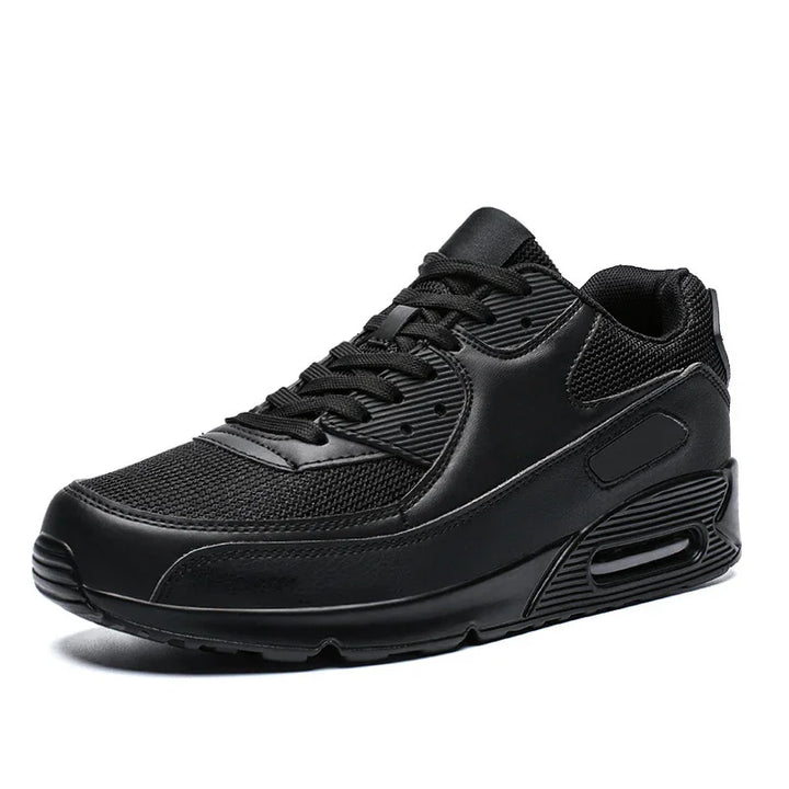 Black athletic sneaker with mesh and leather upper, cushioned sole, and air cushioning unit