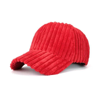 Red ribbed knit baseball cap with curved brim on white background