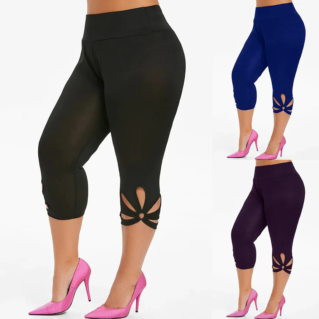 Women's cropped leggings in black, blue, and purple with cutout flower detail at calves, worn with pink high heels