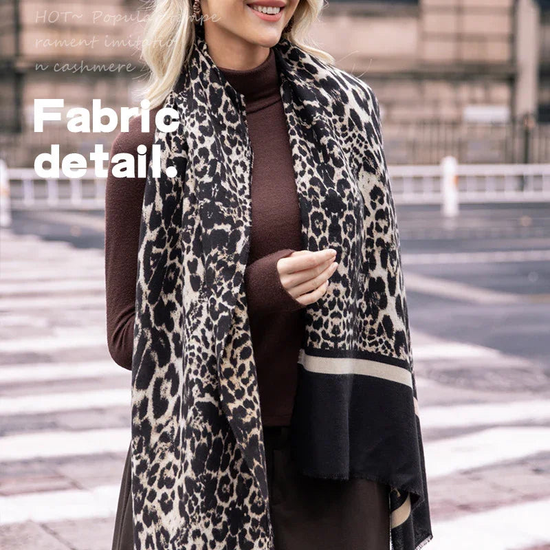 Woman wearing leopard print scarf and brown long-sleeve top outdoors fabric detail