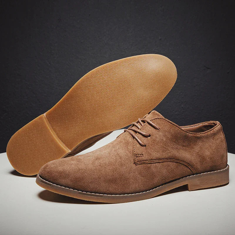 Men's casual brown suede lace-up shoes with rubber soles on gray background