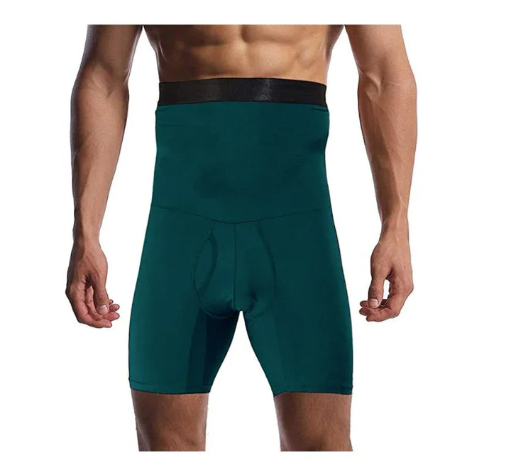 Male model wearing high-waist dark green slimming compression shorts with black waistband