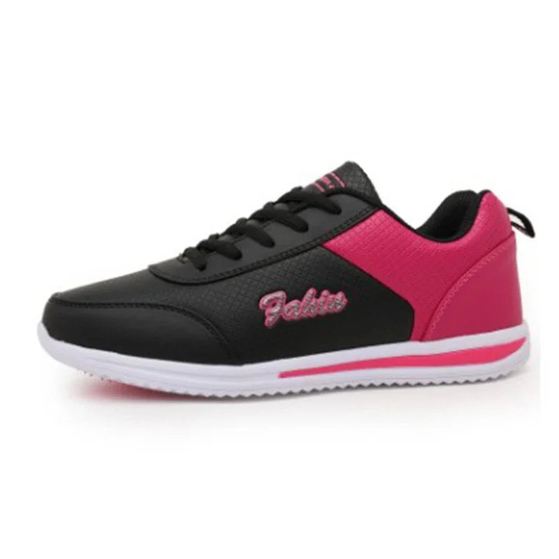 Black and pink casual athletic shoe with white sole and lace-up design