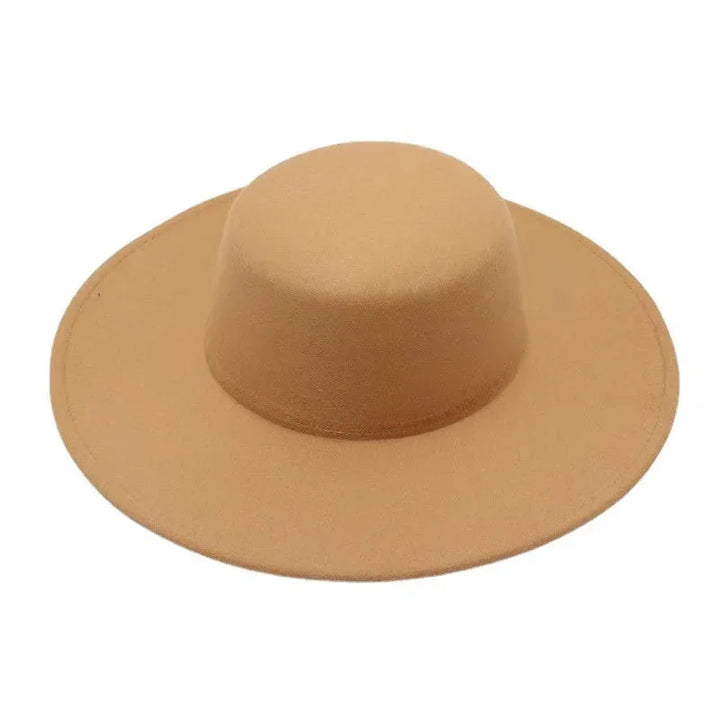 Wide-brimmed tan felt hat with flat top crown isolated on white background