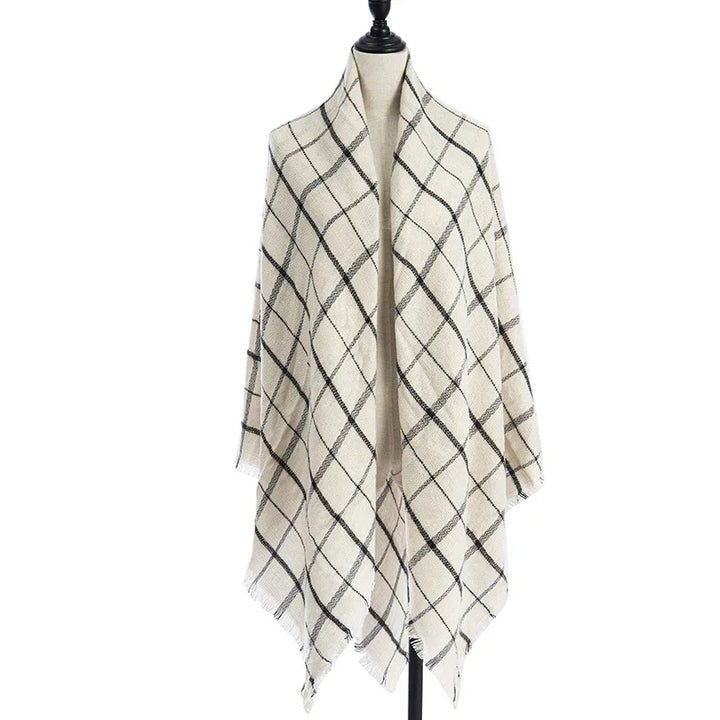 Cream scarf with black diagonal plaid pattern displayed on mannequin against white background