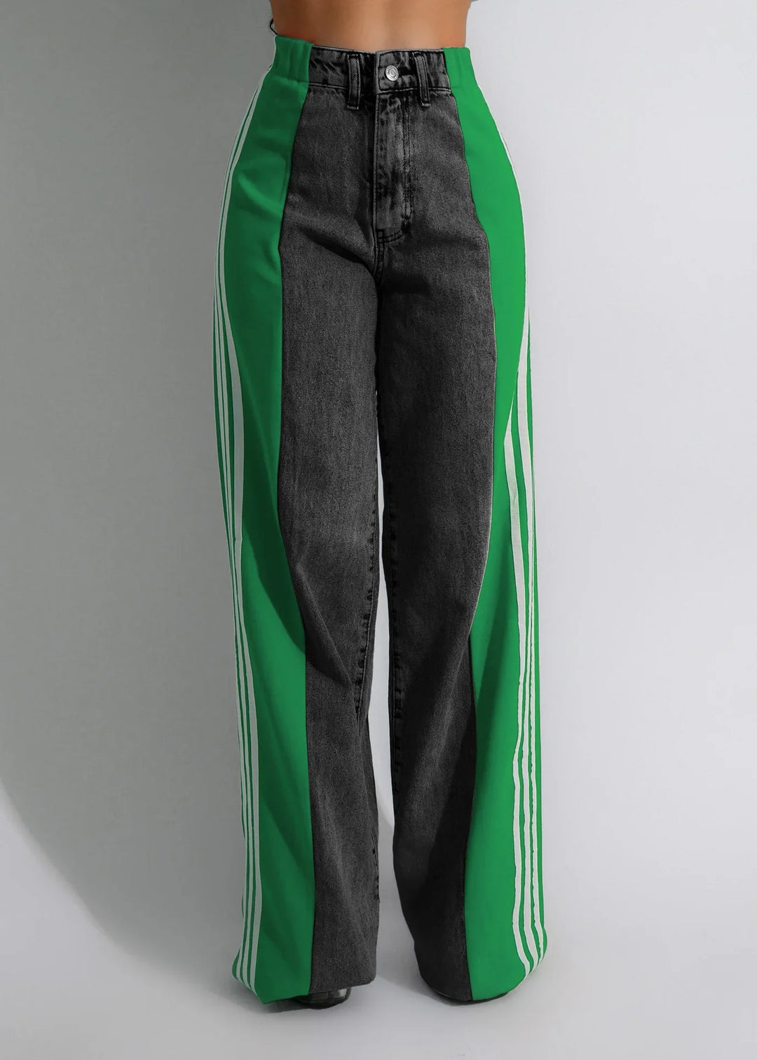 High-waisted black jeans with wide green side panels and white stripes, on model against plain background