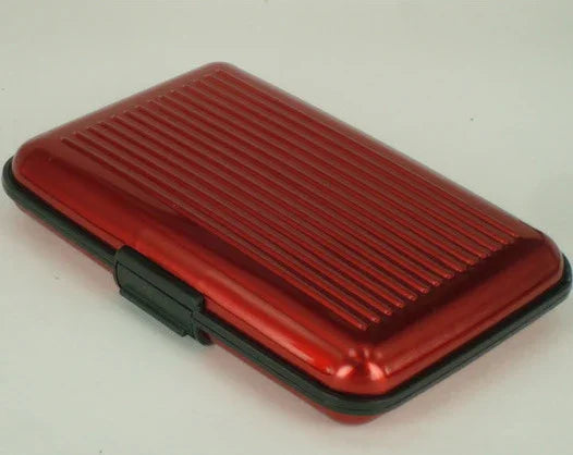 Red hard-shell card holder case with black clasp and ridged surface design