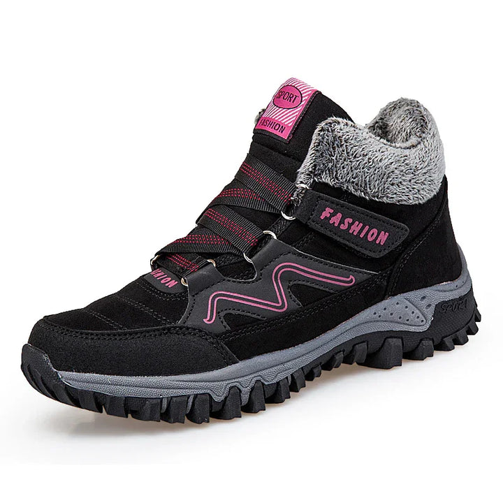 Black and pink women's winter hiking boot with fur lining and rugged sole