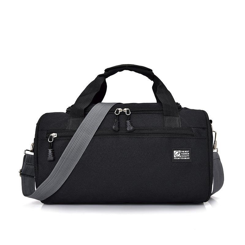 Black duffel gym bag with gray adjustable shoulder strap and front zipper pocket